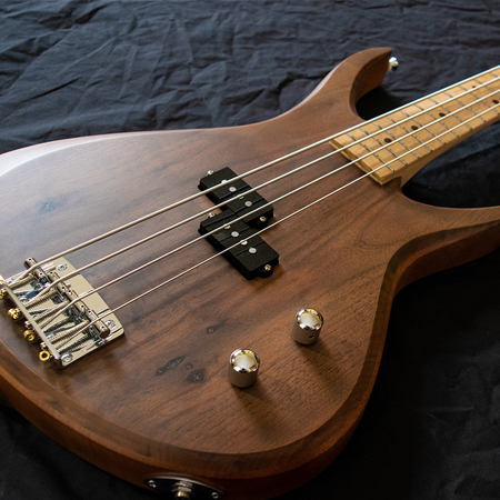 Natutally finished Walnut and Mahogany four string bass electric guitar
